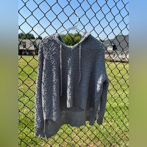 Grey hoodie sweater in size medium.